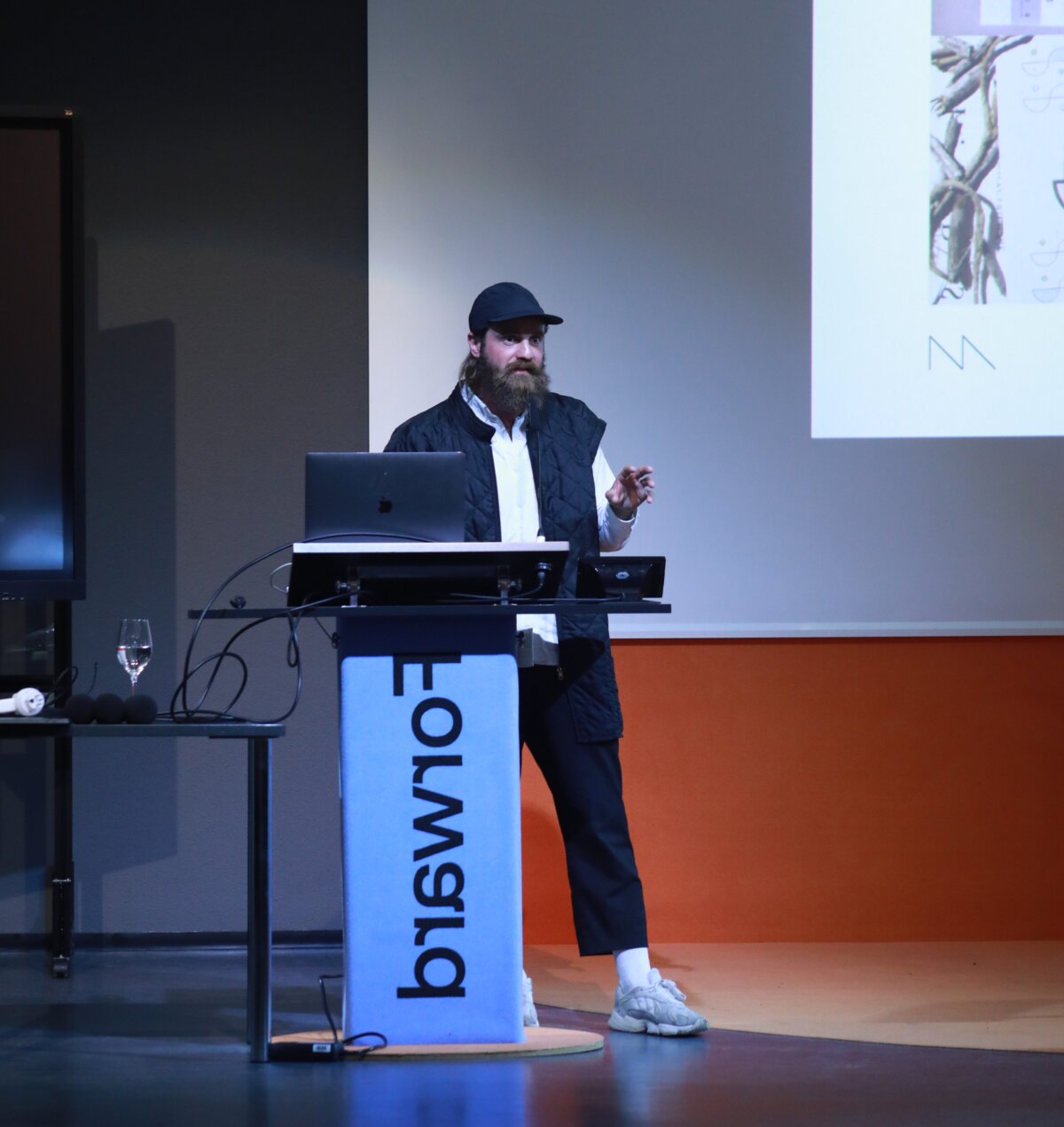 A speaker gives a presentation at the Post Growth Symposium | © FHV