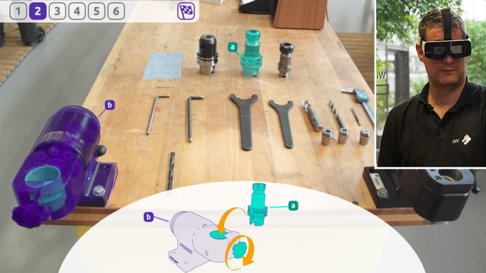 SimLearn | © FHV Ein Mann hat eine VR-Brille auf, dahinter sieht man das Bild, welches er in der Brille sieht | © FHV